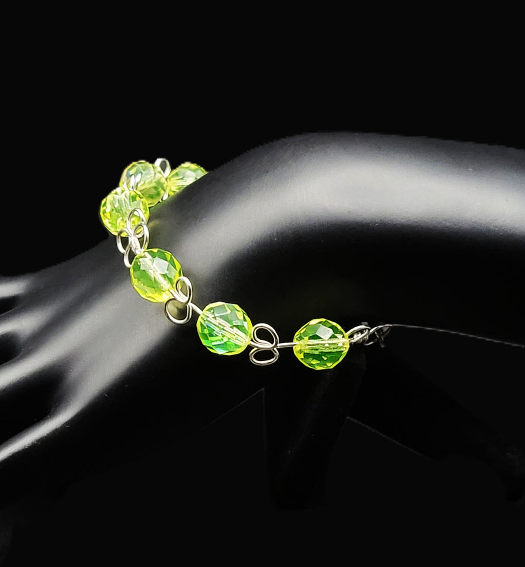 Uranium Czech green faceted glass bead on a Hand wired 6" dainty bangle bracelet with clasp