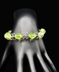 Uranium Czech green faceted glass bead on a Hand wired 6" dainty bangle bracelet with clasp