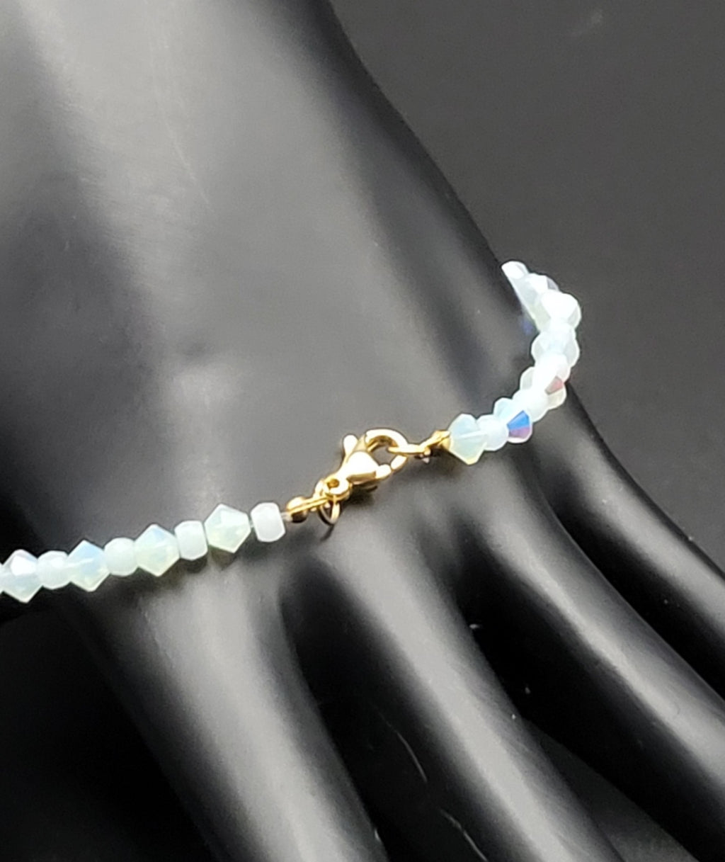 Glow in the Dark blue glass beads and blue AB crystals strung on 7"cord with clasp bracelet