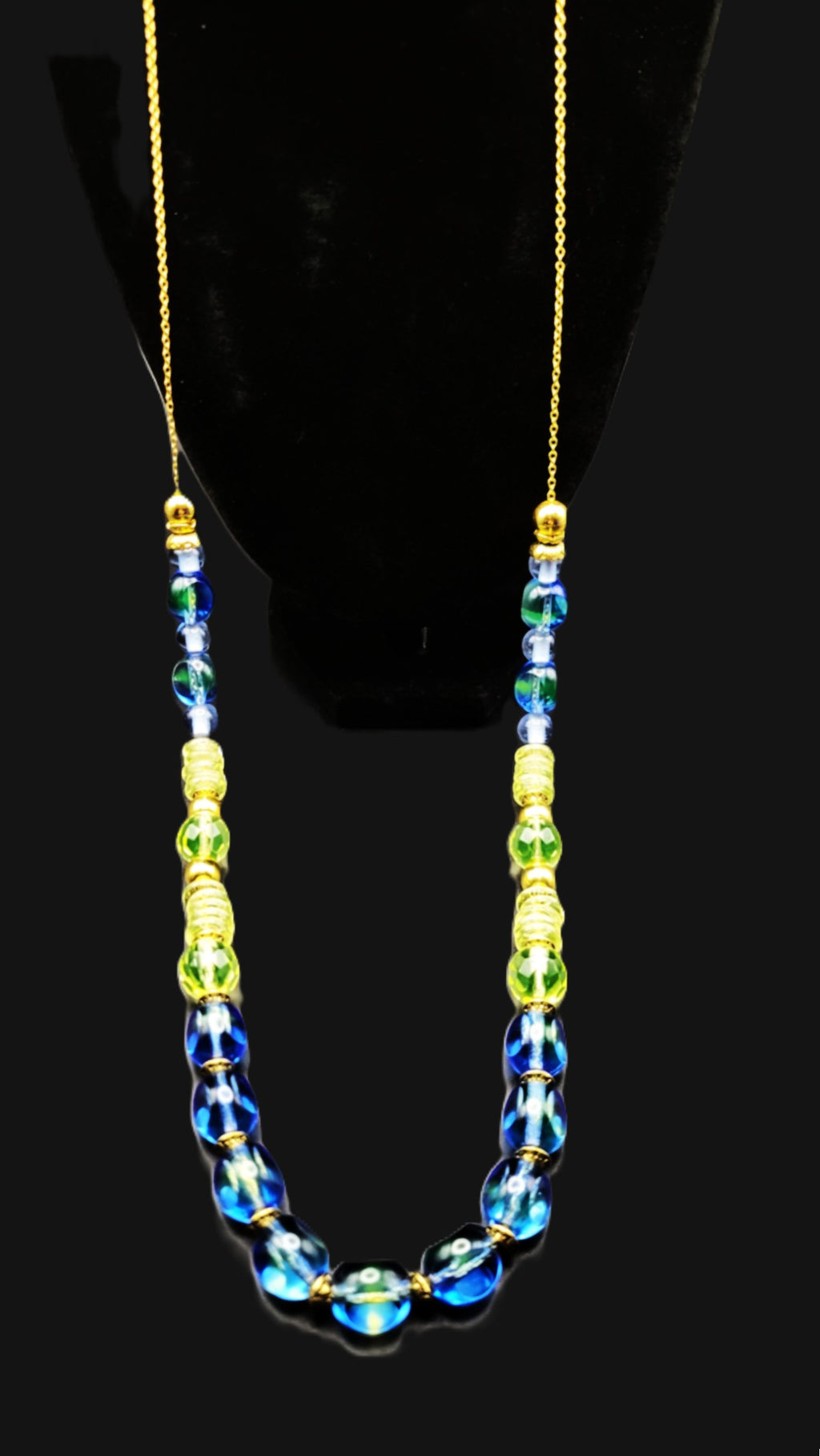 UV Reactive blue and green Czech glass beads strung on a 30" gold tone chain with clasp necklace