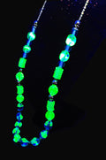 UV Reactive blue and green Czech glass beads strung on a 30" gold tone chain with clasp necklace