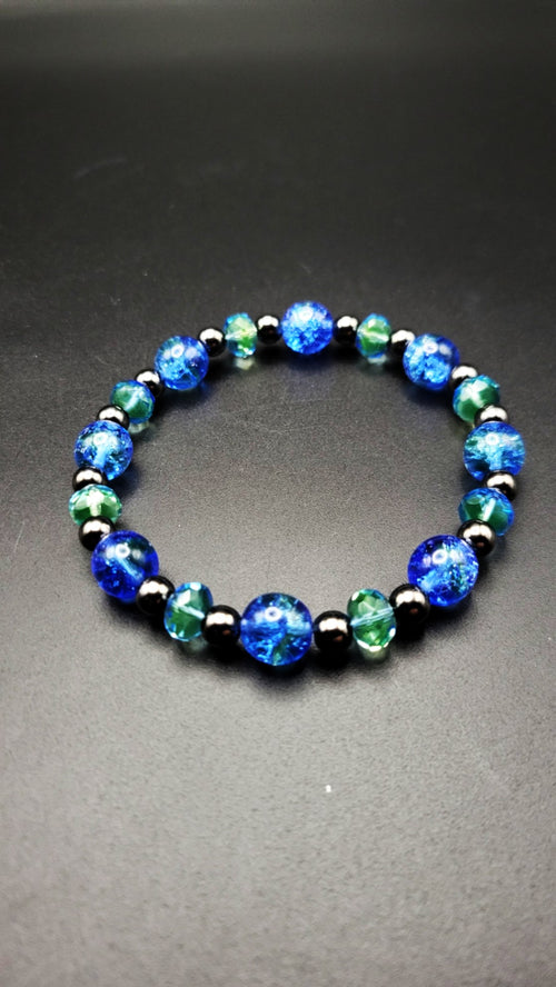 Uranium UV bright glow Czech blue with green swirls crackle glass bead stretch bracelet 8"