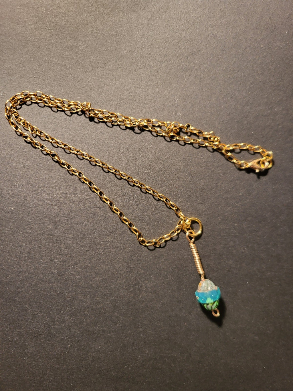 Uranium UV Glow Hand wired pendant, Aqua Czech glass bead pendant on an 18" Gold Tone Oval Link Chain