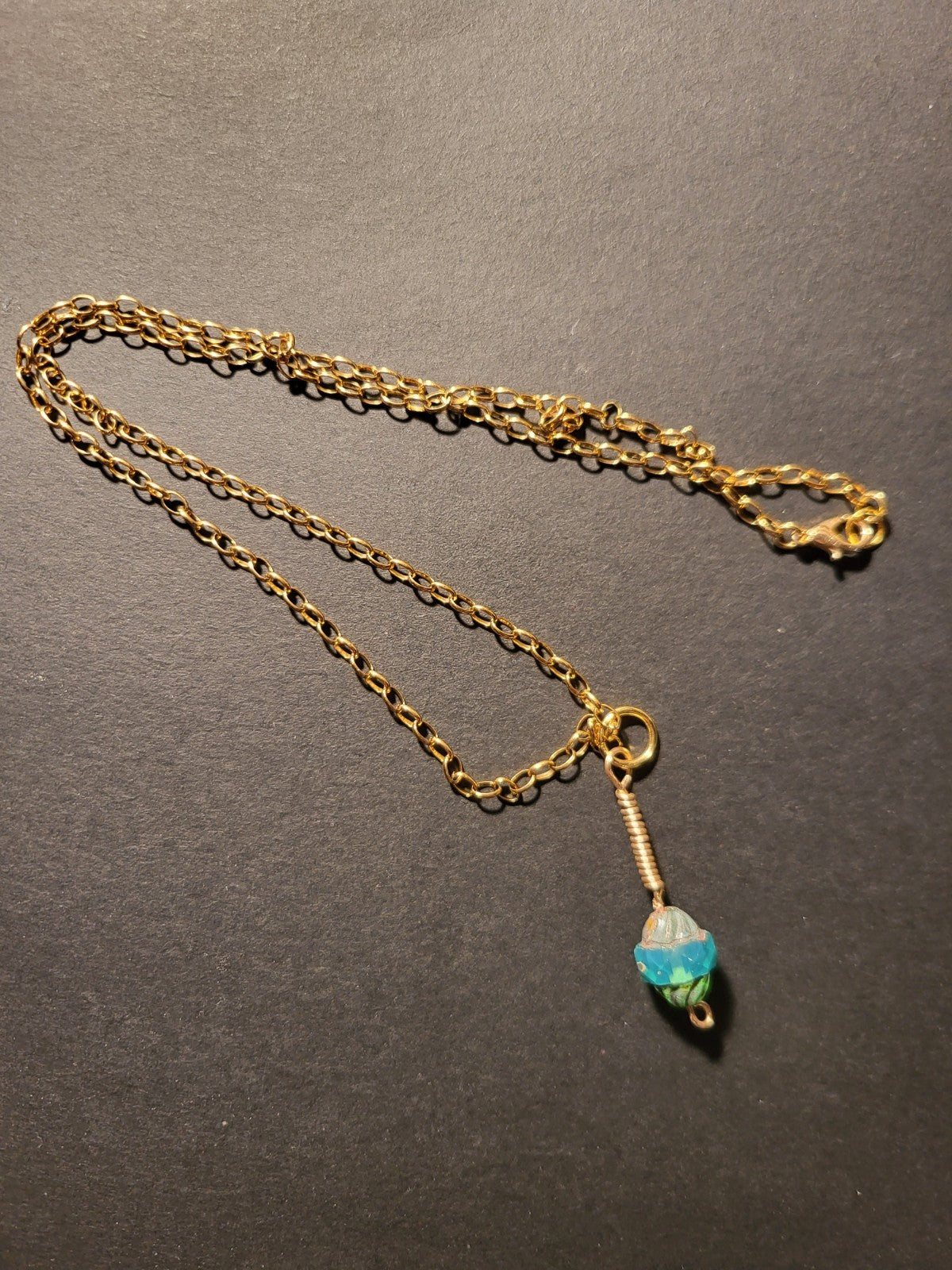 Uranium UV Glow Hand wired pendant, Aqua Czech glass bead pendant on an 18" Gold Tone Oval Link Chain