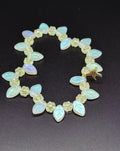 Uranium UV Glow Yellow Flowers with Iridescent Leaves, Starfish Charm Stretch 8" Bracelet